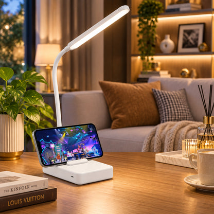 Lampe de bureau LED blanche avec un smartphone calé dans le support du socle